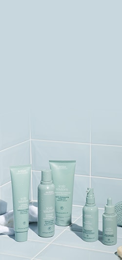 Icons set on a plinth with a green curtain behind